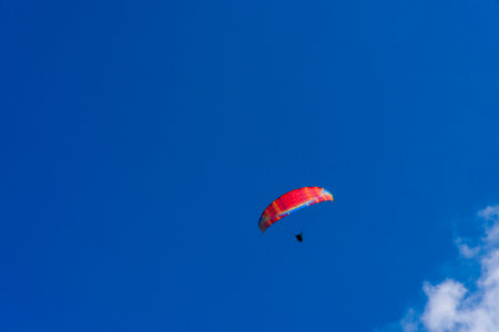 Paragliding extreme Sport with blue Sky and clouds on background Healthy Lifestyle and Freedom conceptの写真素材