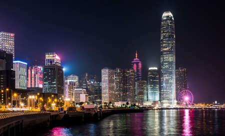 Hong Kong Modern business buildings with the Ferris wheel and skyscrapers in the background, Central Hong Kong. International Finance Center(IFC) in Hong Kong.のeditorial素材