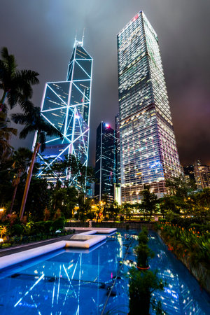 night view of modern business buildings in Central, Hong Kong.