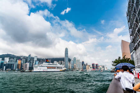 view of a large cruise ship sailed into Hong Kong's Victoria Harbour in china.のeditorial素材