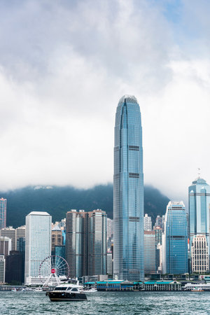 view of a yacht sailing into Hong Kong's Victoria Harbour in china.