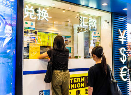 Money changer shop; There are a large number of money changers around tourist areas or commercial districts in Hong Kongのeditorial素材
