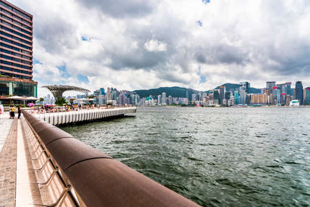 Tourists visiting the Avenue of the Stars. The Avenue of Stars is located along the Victoria Harbor in Hong Kong.のeditorial素材