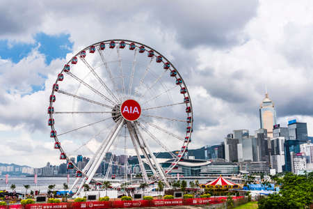 Ferris wheel and skyscraper in Hong Kong.のeditorial素材