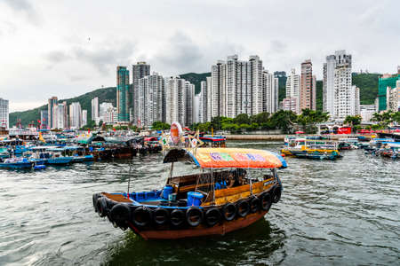 Traditional fishing trawler in Aberdeen Bay. A famous floating village in Aberdeen is an area and town on the south shore of Hong Kong.のeditorial素材