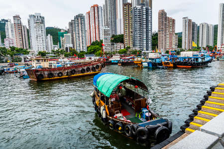 Traditional fishing trawler in Aberdeen Bay. A famous floating village in Aberdeen is an area and town on the south shore of Hong Kong.のeditorial素材