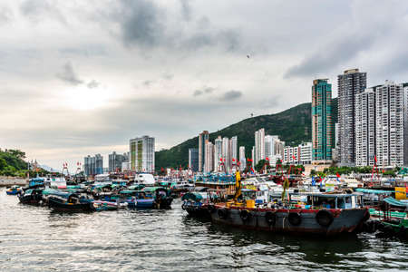 2019: Traditional fishing trawler in the Aberdeen Bay. Famous floating village in Aberdeen is an area and town on the south shore of Hong Kong Islandのeditorial素材