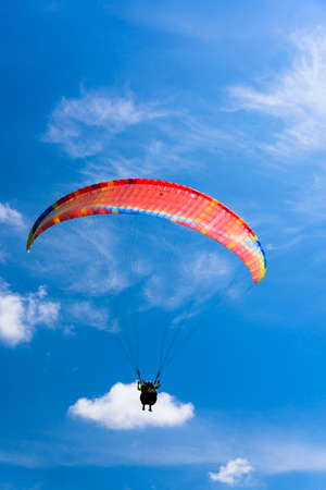 Paragliding extreme Sport with blue Sky and clouds on background Healthy Lifestyle and Freedom conceptのeditorial素材