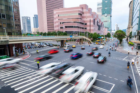 The crossroads near Taipei 101 Building and Taipei International Convention Center in Taipei, Taiwan, is in a busy rush hour of traffic.のeditorial素材