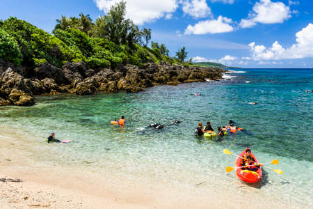 Tourists explore the intertidal zone along the coast of Wanlitong in Kenting National Park, Pingtung, Taiwan.のeditorial素材