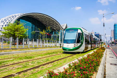 Cityscape of light rail train and the metropolitan building in Kaohsiung, Taiwan.のeditorial素材