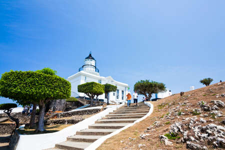 Tourists are visiting the Cihou Lighthouse in Kaohsiung, Taiwan.のeditorial素材