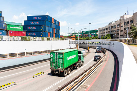 Trucks go through the Cross-Harbor Tunnel in the port of Kaohsiung, Taiwan. It's the only submarine...