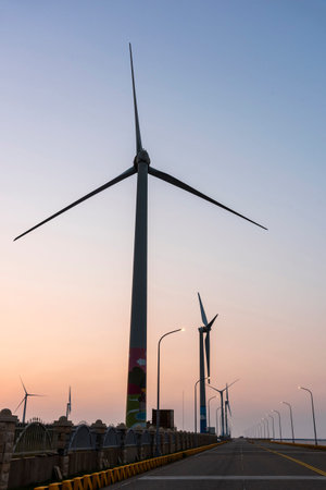 Sunset view of Gaomei Windmill Avenue in Taichung, Taiwan. It's energy systems and renewable energy.