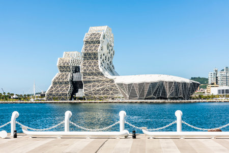 Building view of Kaohsiung Music Center in Taiwan. The white hexagonal building structure on the shore of Kaohsiung Port.のeditorial素材