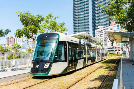 Cityscape of light rail train and the metropolitan building in Kaohsiung, Taiwan.