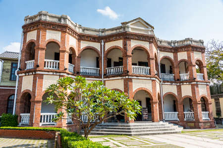 Building exterior of the Old Tainan Magistrate Residence in Taiwan. The residence is a two-story building with an English colonial architectural style.の写真素材
