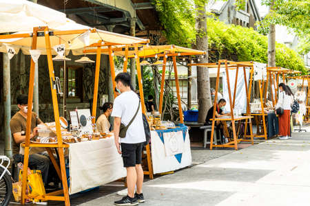 Tourists are visiting the stall at the Huashan 1914 Creative Park in Taipei, Taiwan.のeditorial素材