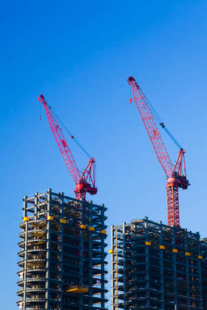 View of the building construction site with cranes in Kaohsiung, Taiwan.のeditorial素材