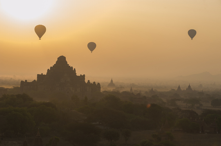 Silhouette of Pagodas field and hot flow balloon at Baganの写真素材