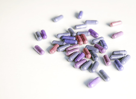Different color of capsule pills use in pharmaceutical manufacturing, drug, medicine.の写真素材