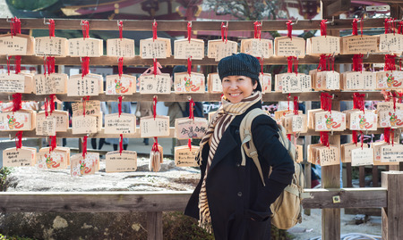 Asian senior female tourist in winter costume traveling in Japanのeditorial素材