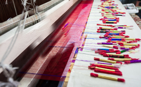 Image of colorful silk Yarn made by Indian weaving loom, Himroo and Paithani technique.の写真素材