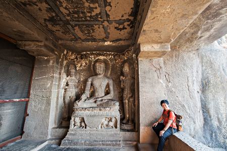 Ellora Caves UNESCO World Heritage Site. Statue of big Buddha inside, sanctuaries devoted to Buddhism, Hinduism and Jainism. Temples and monasteries near Aurangabad District, Maharashtra State, India.の写真素材