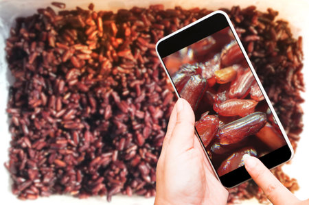 Take a photo Thai jasmine black rice berry with smartphone.