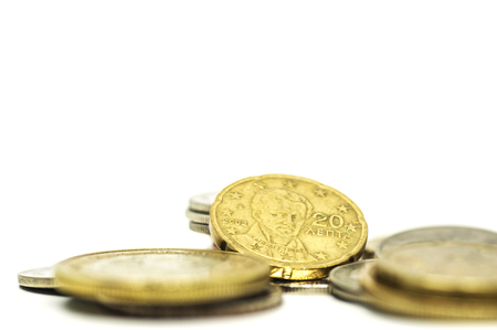 Coin pile, Mexican peso money on solid white background.の写真素材