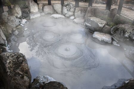 Oniishi bozu jigoku (Mud Hell), hot boiling grey bubbles mud pond in Umi Jigoku at Beppu, Oita-shi, Kyushu, Japanの写真素材