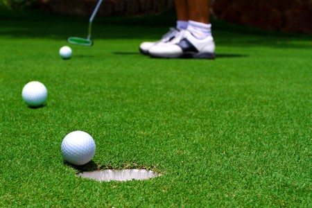 Three golf ball on greenの写真素材