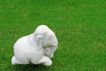 Elephant statue on green grassの写真素材
