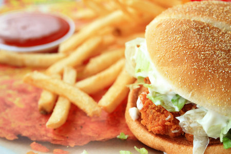 Chicken burger with vegetables and a potato