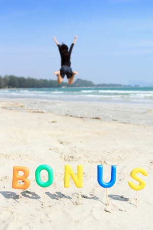 Alphabet  forming the word BONUS and sea view background の写真素材