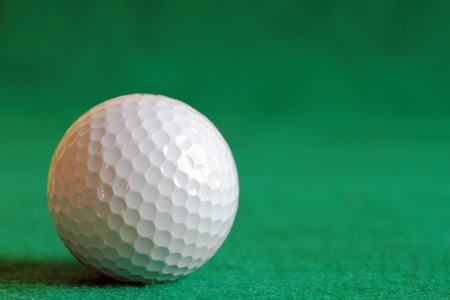 Golf Ball on the Green Grass の写真素材