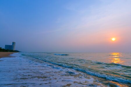 A beautiful sunrise over the natural background of the morning sea.の写真素材