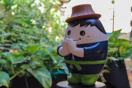 Blue and green peasant doll standing at the handの写真素材