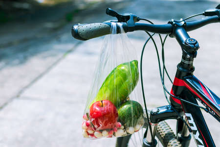 Fruit bags hanging on the bike handlebarsの写真素材