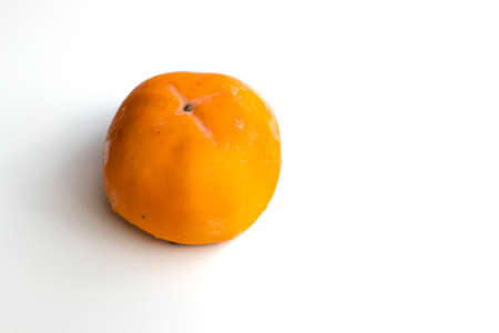 Persimmon orange fruit on a white backgroundの写真素材