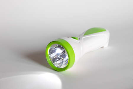 Plastic flashlight isolated on a white backgroundの写真素材