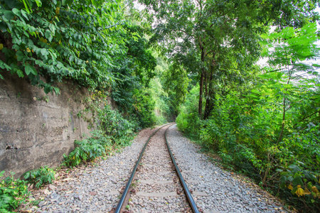 Railroad and the mountains and the sky in Kanchanaburi in Thailand.