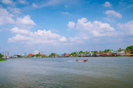 The landscape of the Chao Phraya River and the city on both sides of the river in Thailandの写真素材