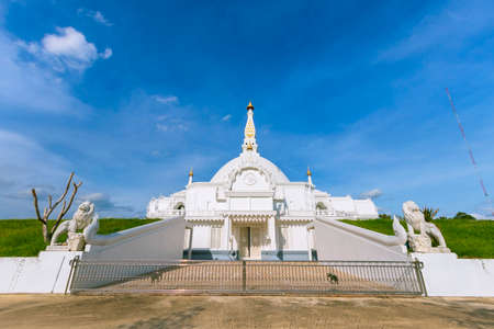 White pagoda at Bueng Lat Thawi temple in Thailandの写真素材