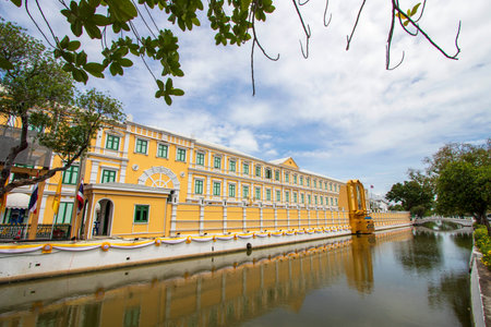 Beautiful yellow buildings along the canal of Bangkok in Thailand