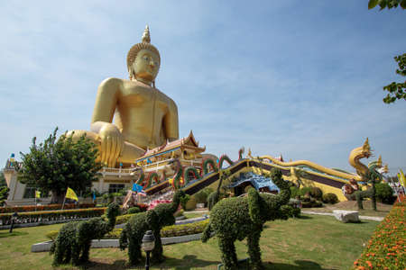 Large gold Buddha statue at Wat Muang in Ang Thong Province in Thailandの写真素材