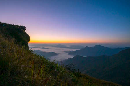 Mountain scenery with beautiful sky and white clouds with morning sun in Chiang Rai Province, Northern Thailand.の写真素材