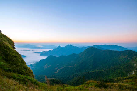 Mountain scenery with beautiful sky and white clouds with morning sun in Chiang Rai Province, Northern Thailand.の写真素材