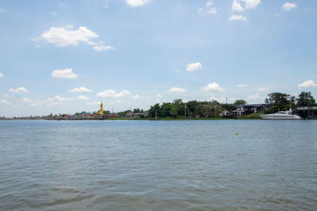 The landscape of the Chao Phraya River and the city on both sides of the river in Thailandの写真素材