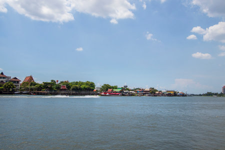 The landscape of the Chao Phraya River and the city on both sides of the river in Thailandの写真素材